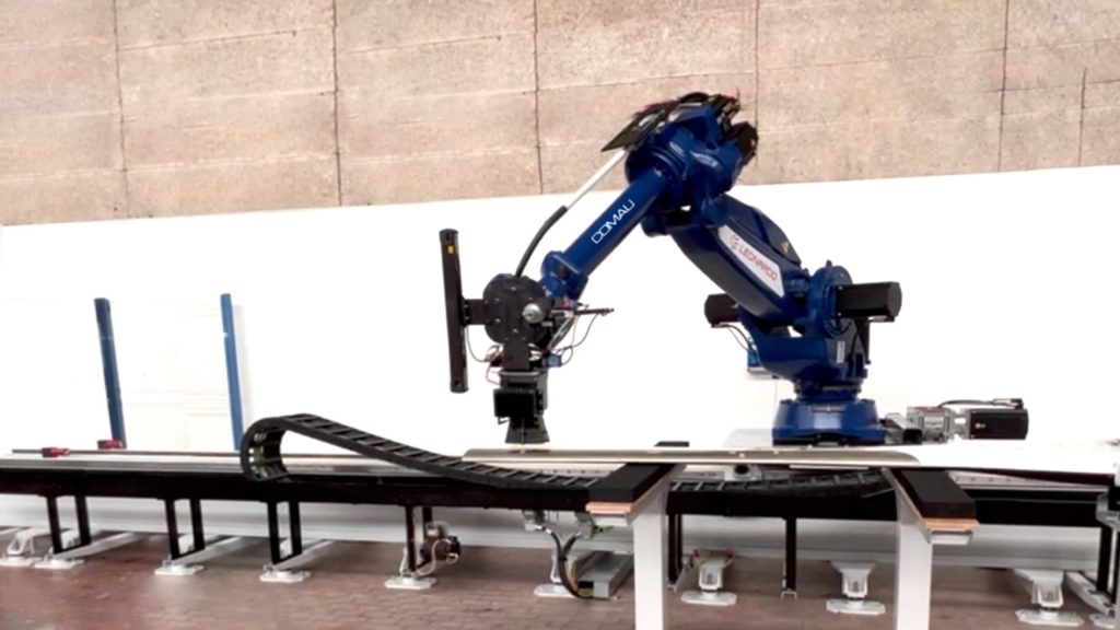 comau robot perfoming automated inspection