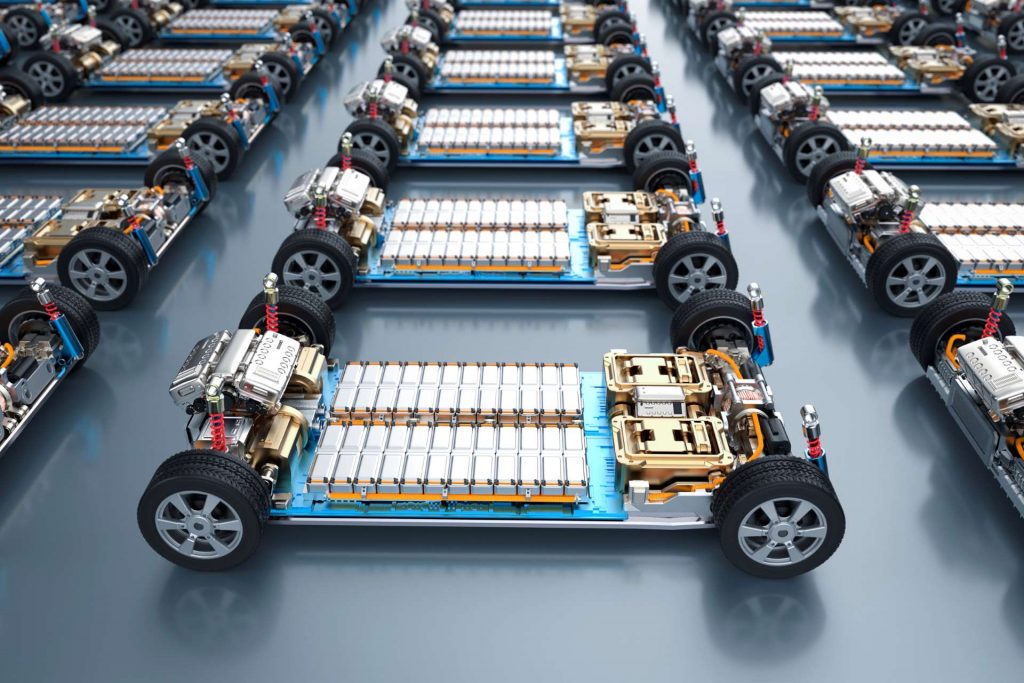 Electric vehicles line up with battery packs